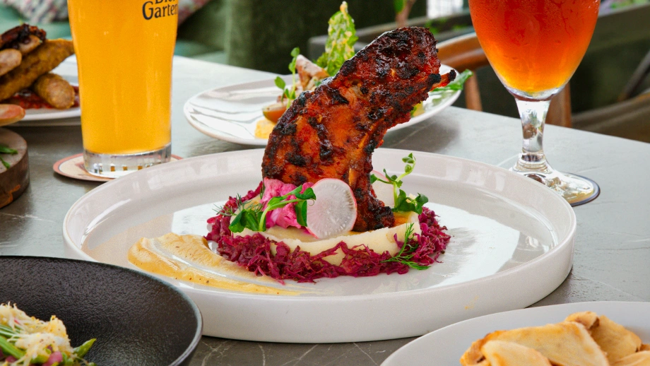 Craft beer paired with a roasted meat platter served during afternoon lunch in Koramangala.