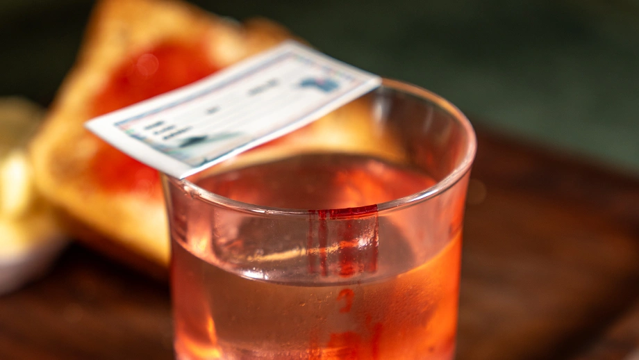 A signature craft cocktail with a nostalgia-themed paper garnish served at Biergarten, an innovative brewery in Bangalore.